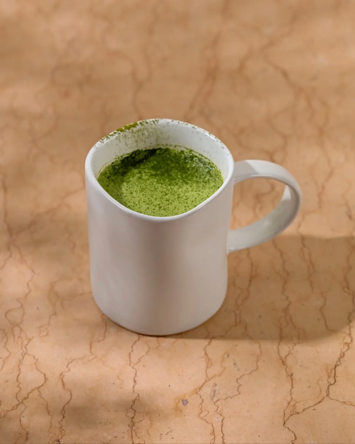 A mug of vibrant green matcha at baan125 hangout